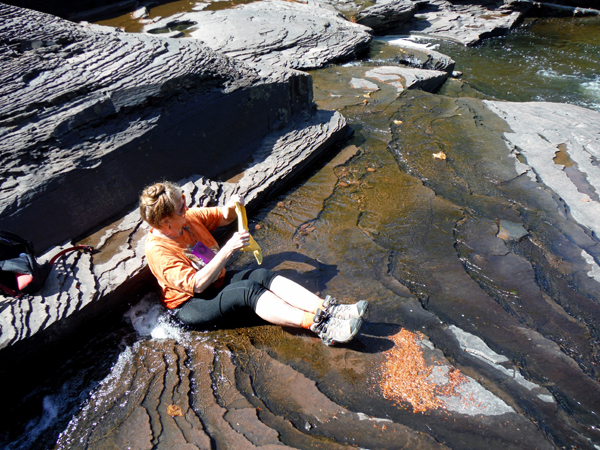 Karen Duquette cooling off in the waters of Manido Falls